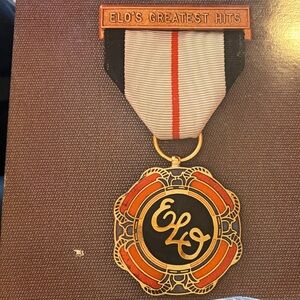ELO's Greatest Hits Medal with Gold and Orange Accents